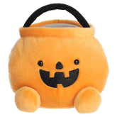 Large orange pumpkin candy bucket plush with a smiling jack-o'-lantern face