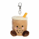 Tea Boba plush Clip-On from Palm Pals, featuring a creamy tan body with dark brown boba pearls and a straw