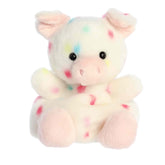 Plush toy of a white pig by Palm Pals with pastel confetti dots, a pink snout, and matching hooves