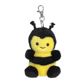 Plush keychain of a yellow bee by Palm Pals with black stripes, fuzzy wings, and tiny antennae.