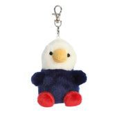 A small red, white, and blue eagle plush clip-on with a gold beak from Palm Pals by Aurora.