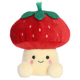 A party-sized mushroom plush toy from Aurora with a cream body, embroidered face, and a strawberry cap with green leaves.