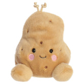 A potato plush toy from Aurora with a soft potato-shaped body, an embroidered face, and a tiny sprout on top.
