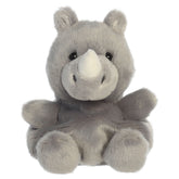 A rhino plush toy from Aurora with gray fur, a tiny horn, and gentle embroidered features.