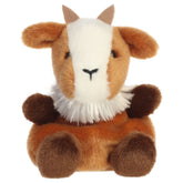A goat plush toy from Aurora with brown-and-cream fur, tiny horns, floppy ears, and an embroidered face.