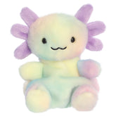 An axolotl plush toy from Aurora with pastel rainbow fur, a sweet embroidered face, and purple frilly gills.