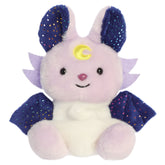A fantasy beast plush toy from Aurora with a light-colored body, deep blue wings, and sweet embroidered features.