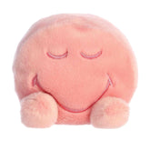 A soft pink plush with closed eyes and a peaceful smile from the SmileyWorld Palm Pals Collection