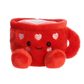 A red latte mug plush with white hearts and a swirl of foam from the Palm Pals Valentine’s Collection