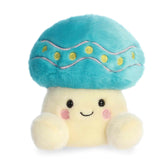 Pastel mushroom plush with rounded Palm Pal shape, soft fabric body, and cheerful smiling face