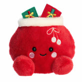 Red Santa sack plush with white trim, pom-poms, wrapped gifts, and a smiling face