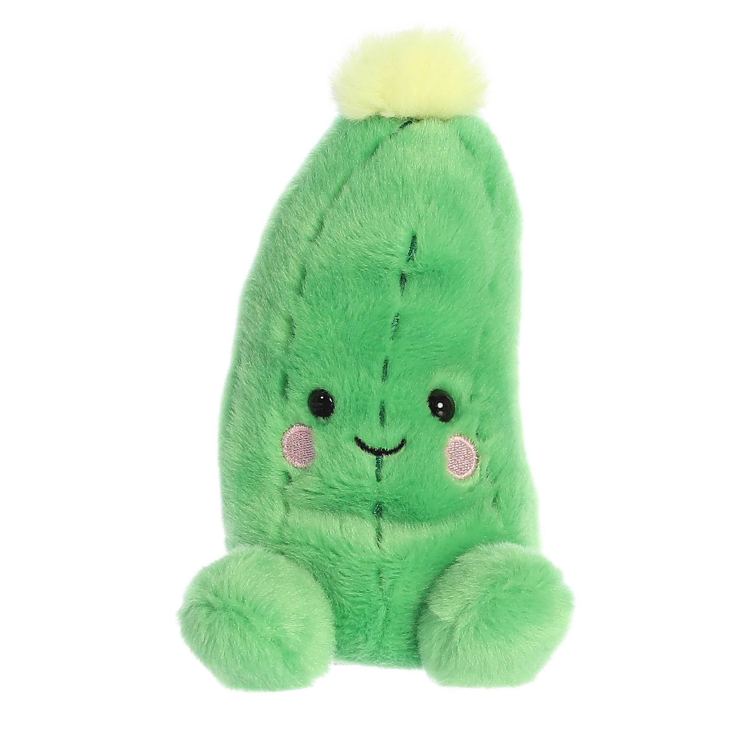 Cuddly mini cucumber shaped plush toy with soft green fur body, textured design, smiling face embroidery and a yellow tassel Cuddly mini cucumber shaped plush toy with soft green fur body, textured design, smiling face embroidery and a yellow tassel
