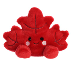 Fall Maple Leaf plush from Palm Pals, with a vibrant red body and leaf patterns to match the colorful fall maple leaf