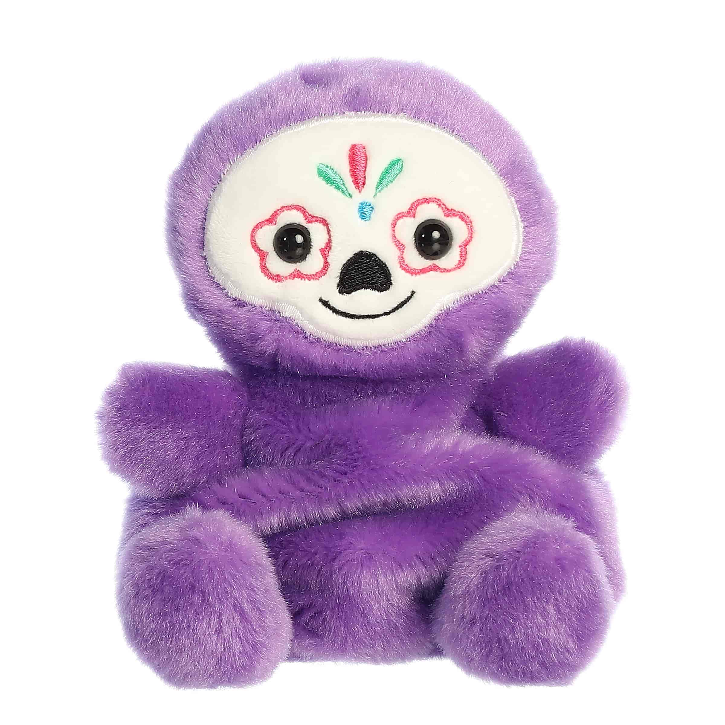 Deep purple palm pal plush with colorful sugar skull face, inspired by Dia de los Muertos.