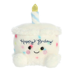 Happy Bday Cake plush from Palm Pals, frosted with confetti sprinkles and golden candle, joyful