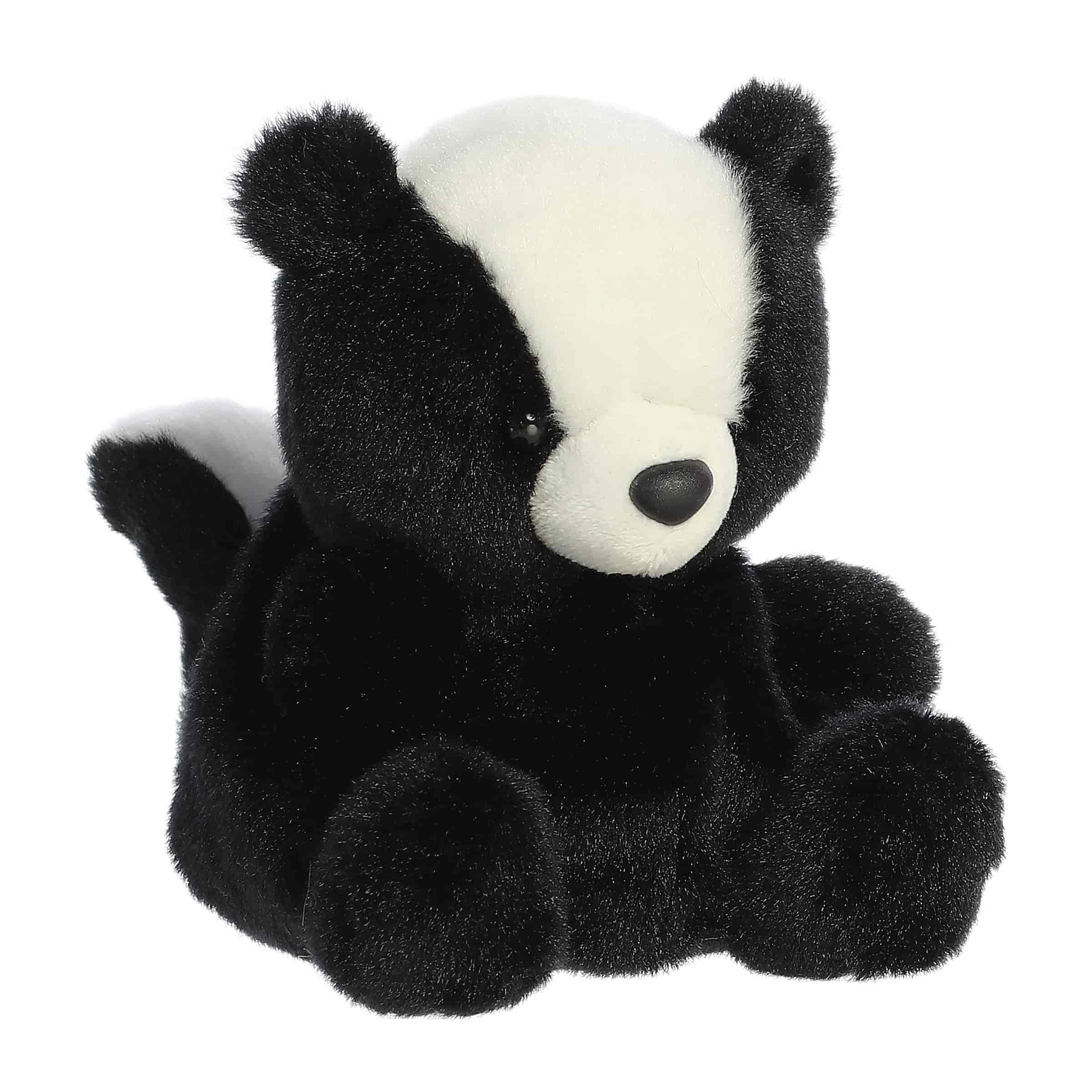 Plush toy of a small skunk in the Palm Pals collection with a white stripe on its back.
