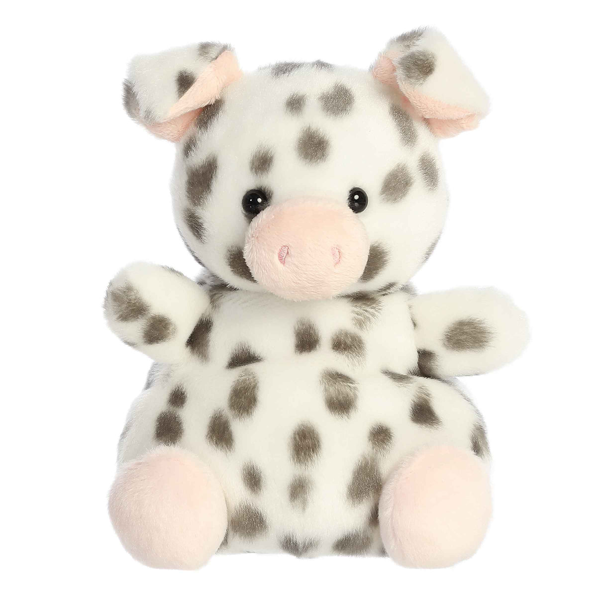 Larger plush toy of a white piglet in the Palm Pals collection, covered in black spots