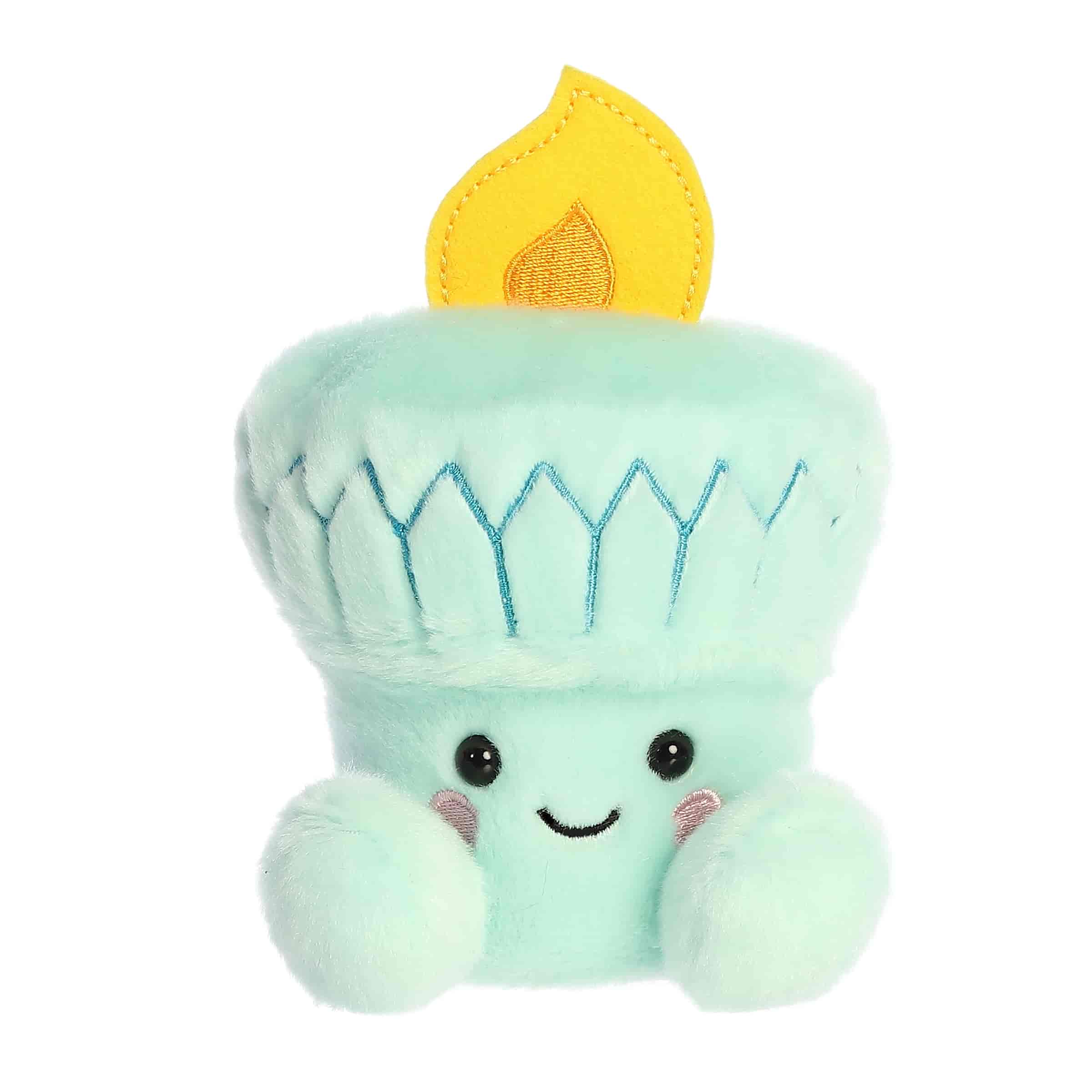 A small mint-green torch plush with a stitched flame and cheerful smile from Palm Pals by Aurora.