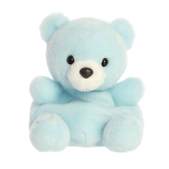 A small powder-blue bear plush with a white snout and gentle smile from Palm Pals by Aurora