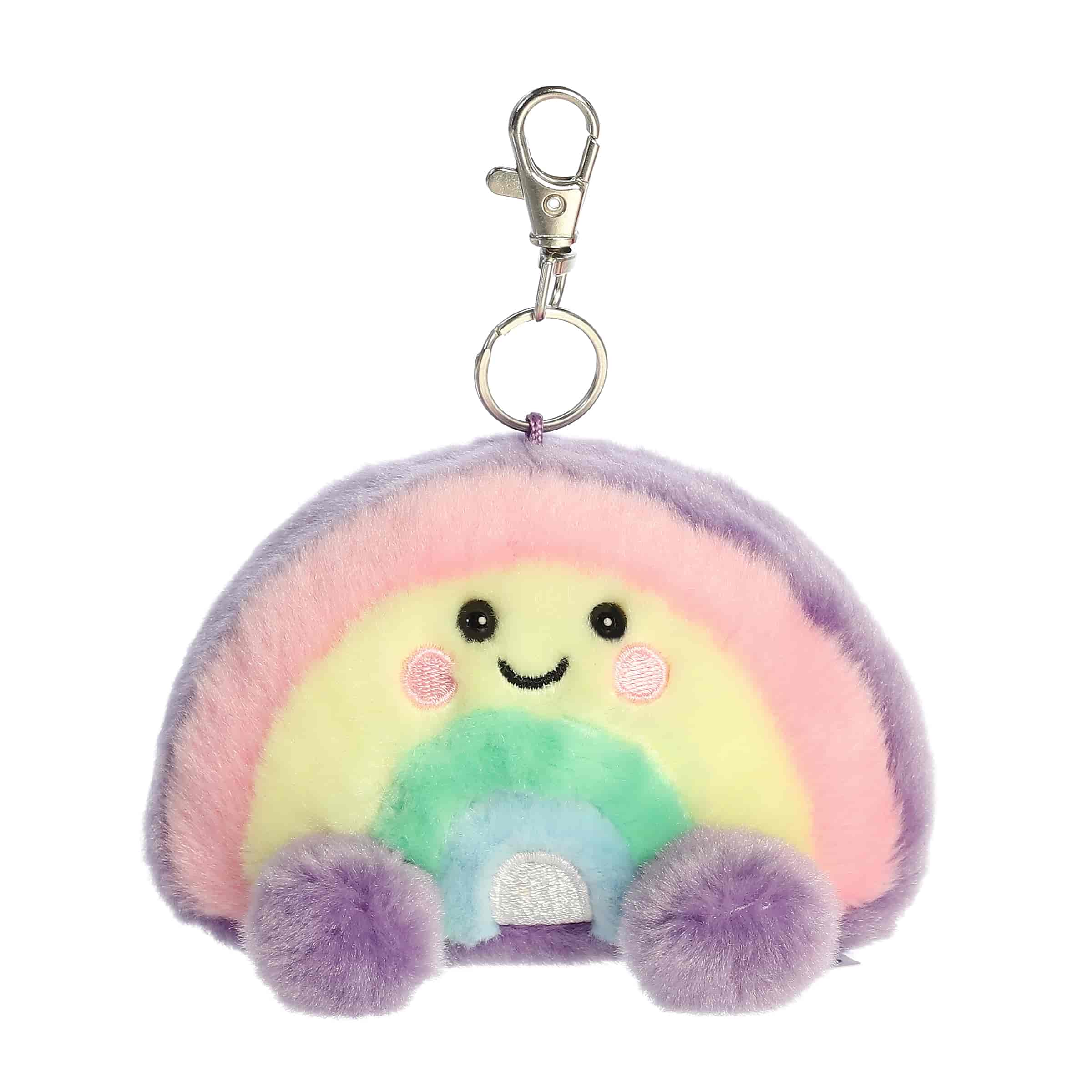 A small pastel rainbow plush clip-on with lavender feet and a smiling face from Palm Pals by Aurora.