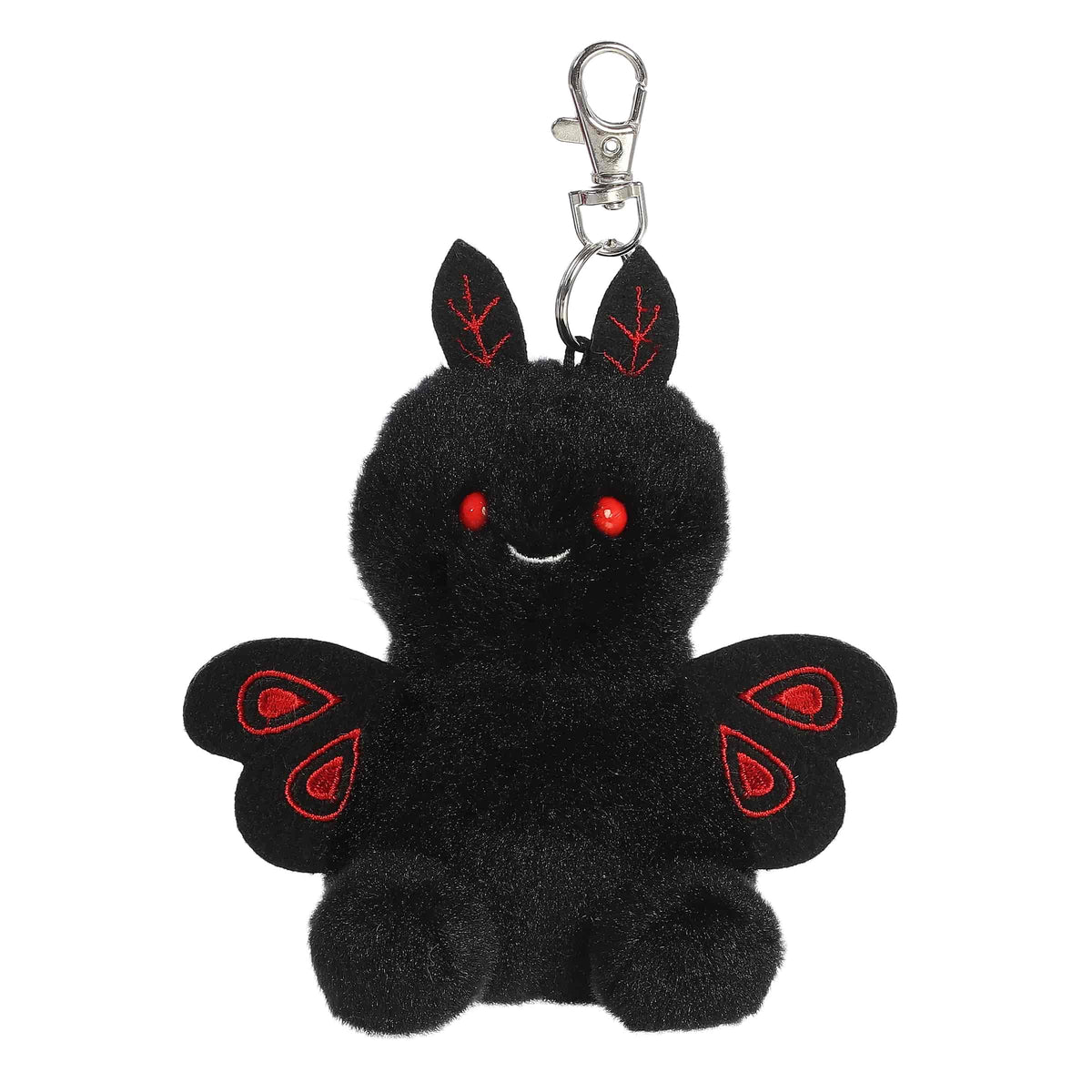 A small black mothman plush clip-on with red eyes and embroidered crimson wings from Palm Pals