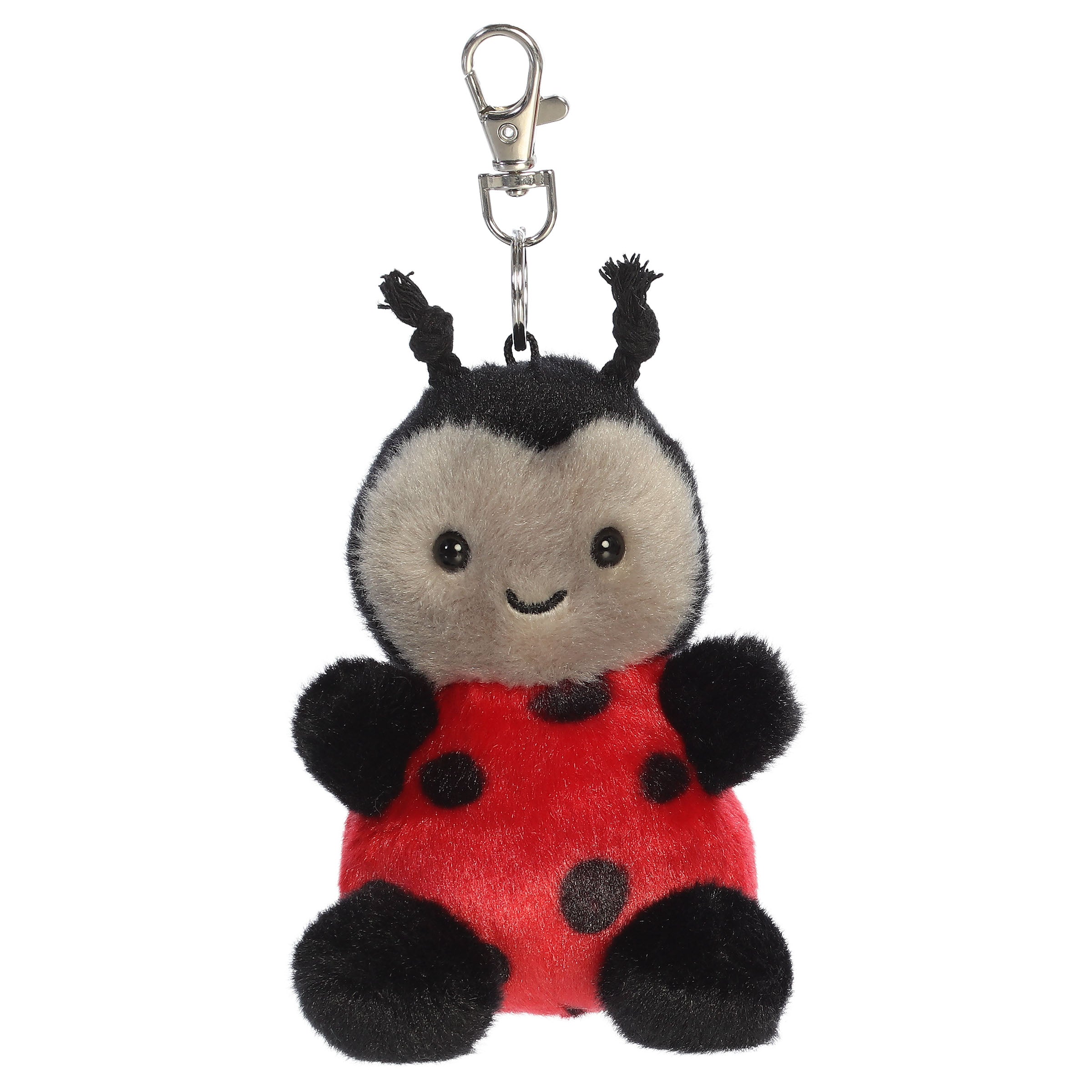 A ladybug plush clip-on from Aurora with a red body, black spots, and tiny antennae.