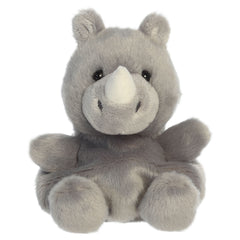 A rhino plush toy from Aurora with gray fur, a tiny horn, and gentle embroidered features.