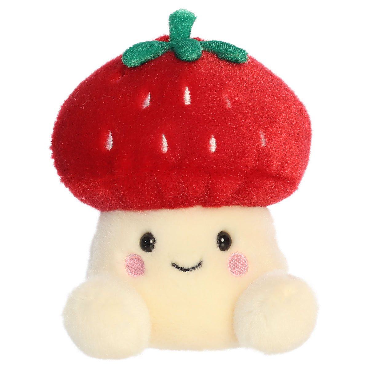 A mushroom plush toy from Aurora with a cream body, smiling embroidered face, and a strawberry cap with leafy green details.