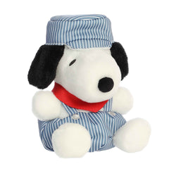 Plush toy from the Peanuts collection featuring Snoopy dressed as a train engineer, complete with striped overalls and hat