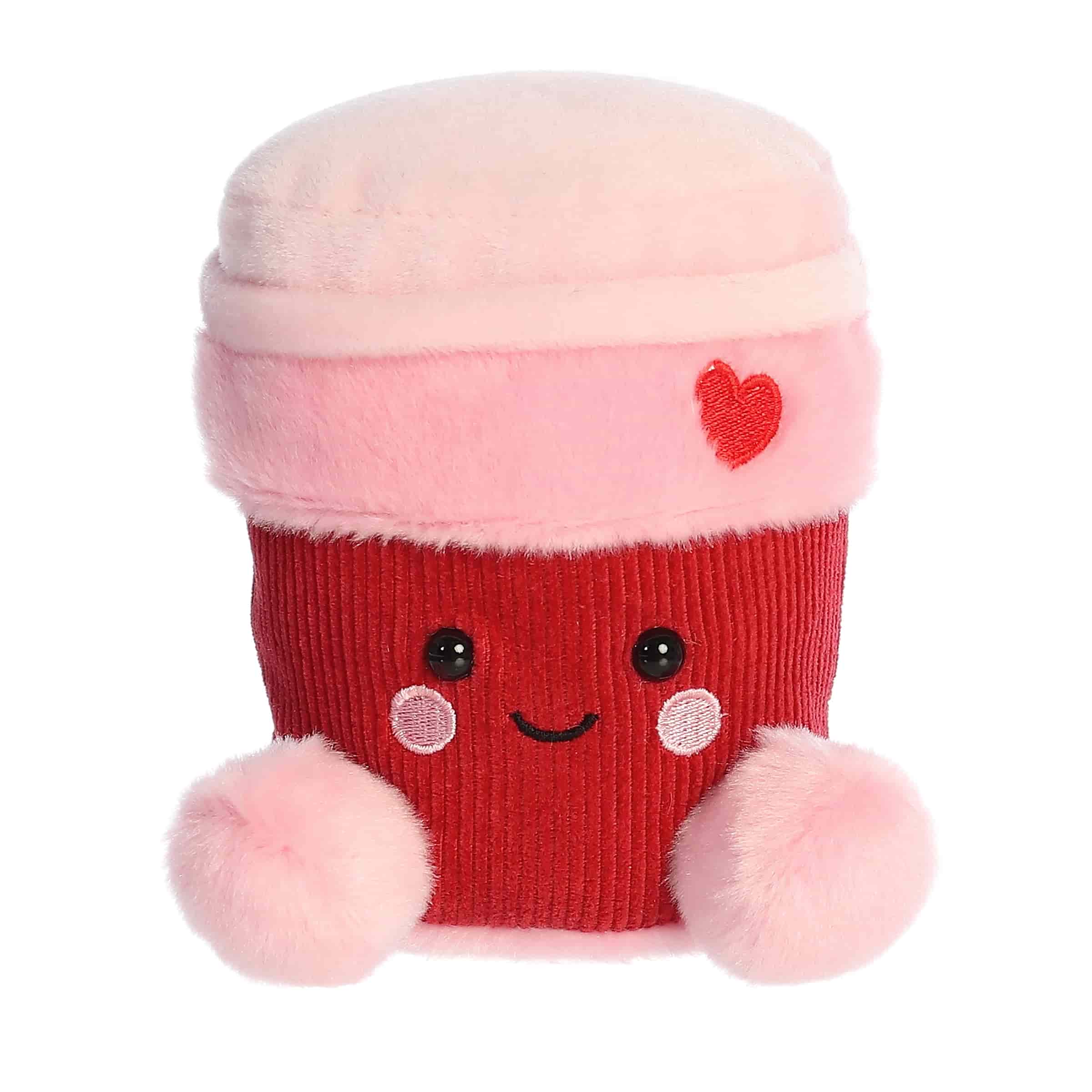 A red and pink latte cup of coffee plush with a small embroidered heart from the Palm Pals Valentine’s Collection