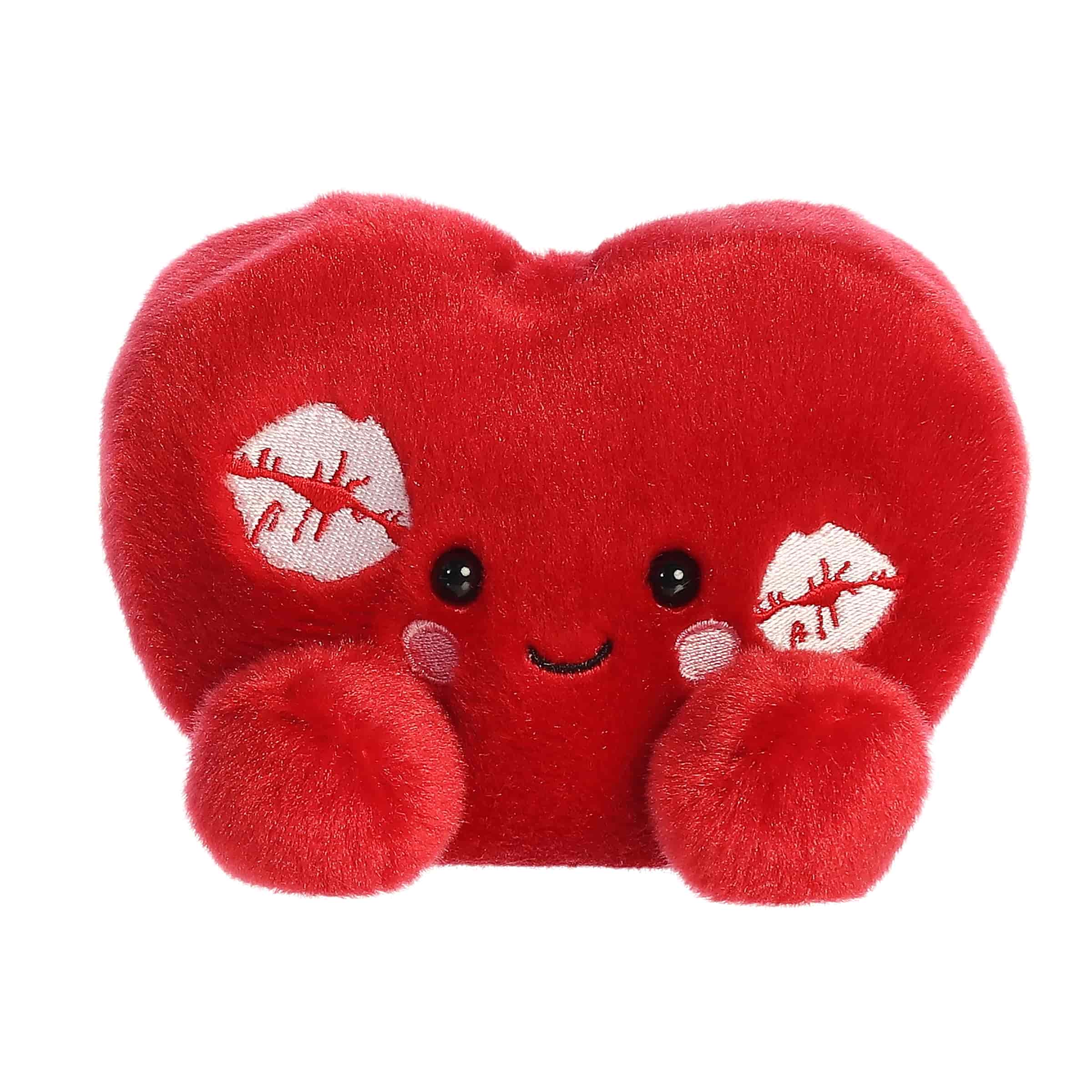 A red heart-shaped plush with kiss marks and rosy cheeks from the Palm Pals Valentine’s Collection