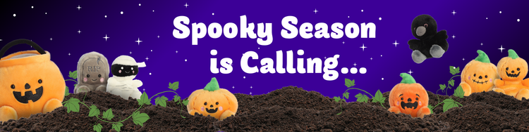 Halloween banner with text Spooky Season is Calling featuring plush pumpkins, a mummy, a tombstone, and a crow against a starry night sky.