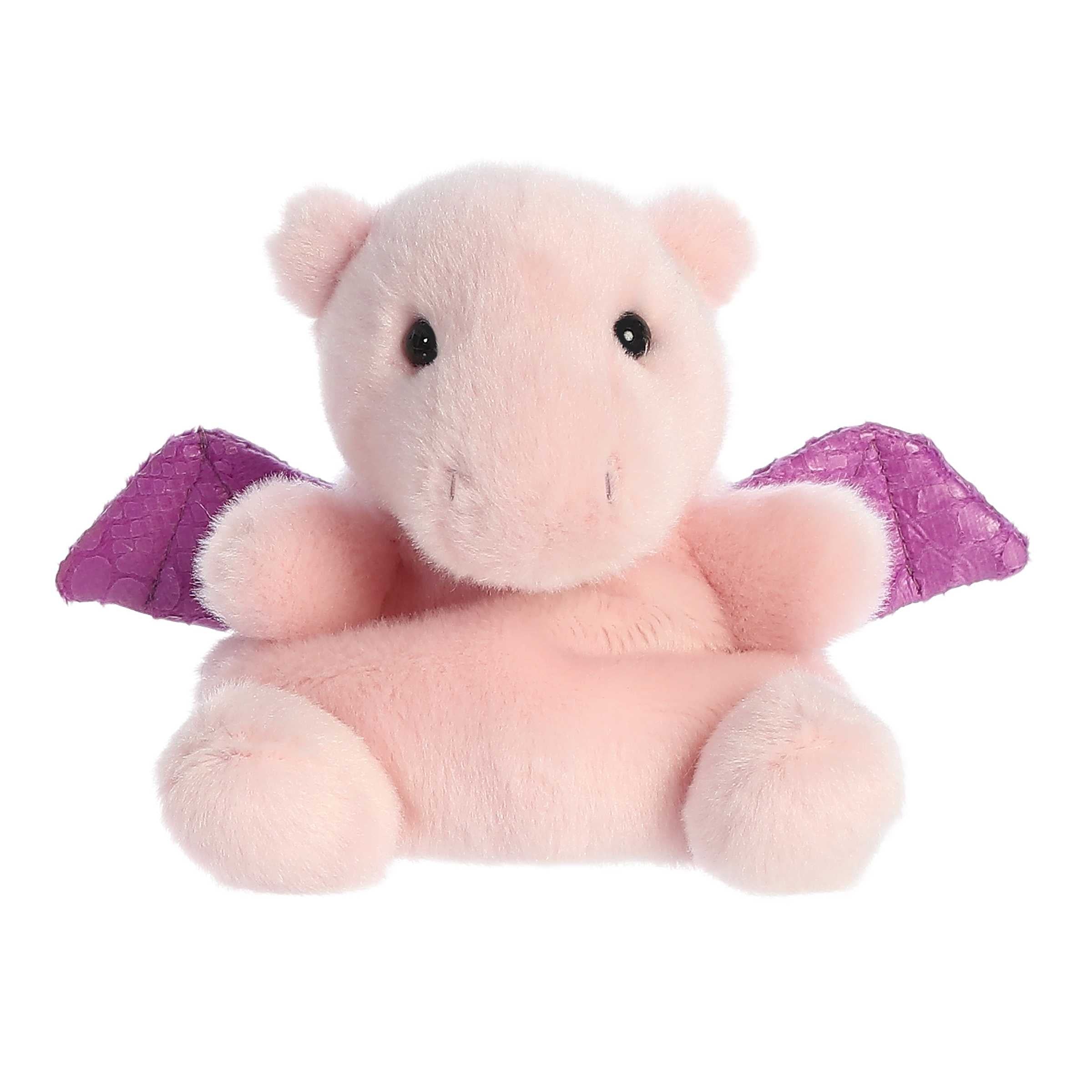 A cute mini dragon plush with soft pink fur, adorable round ears, and a royal purple pair of wings