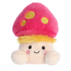 A vibrant mushroom plush in a pink cap with yellow spots and blonde hair sticking out, and cute blushing smile